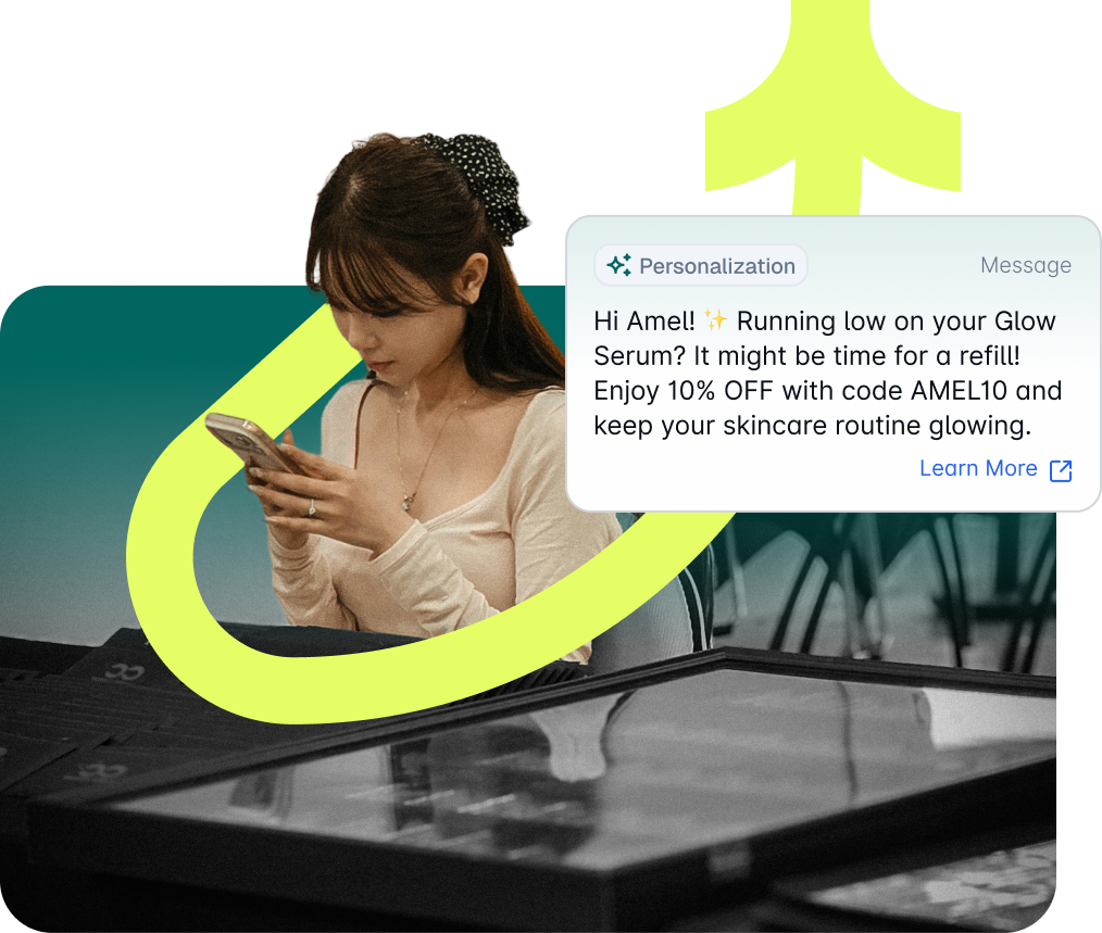 Personalized refill reminder with a 10% off code, shown over a woman reading it on her phone.